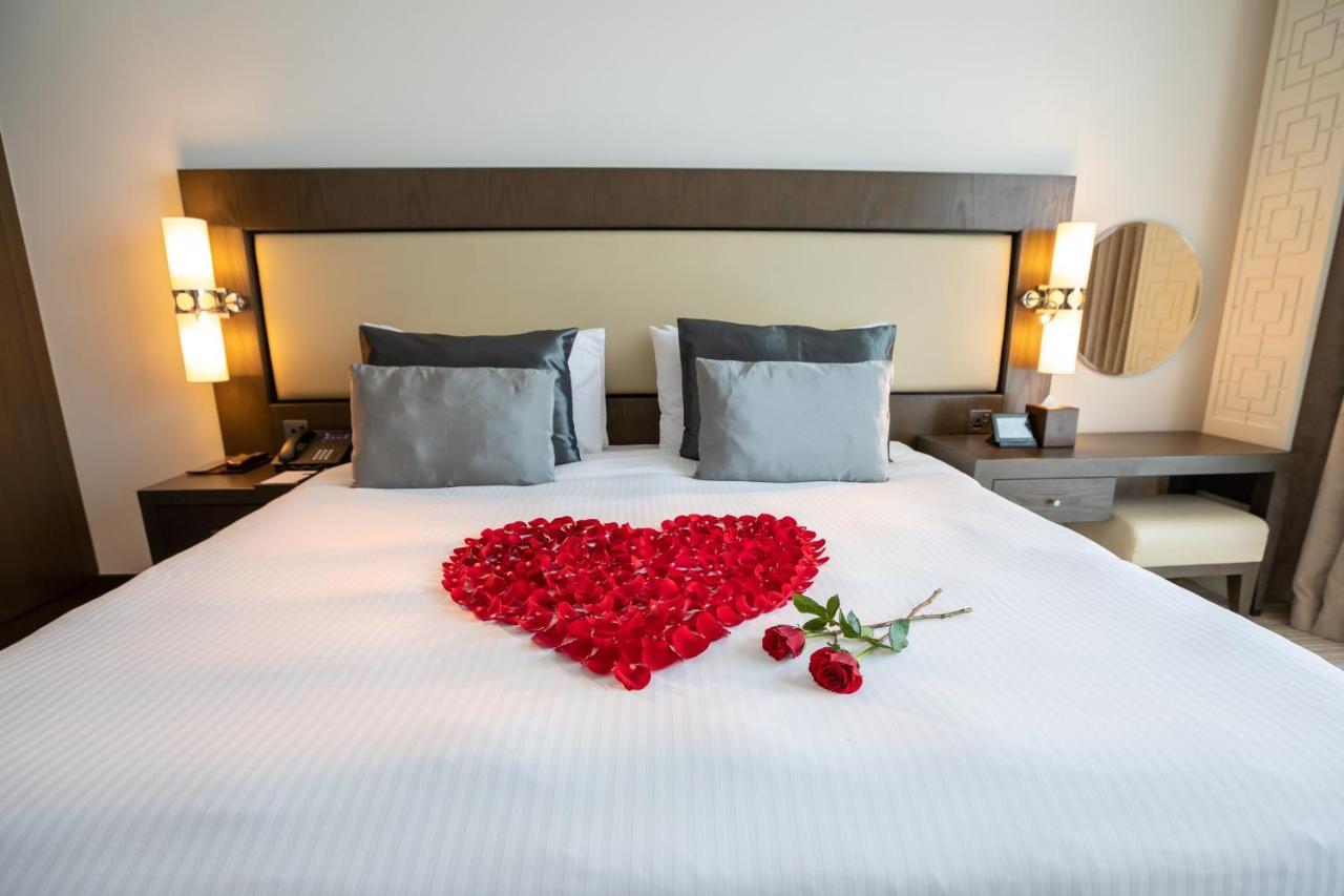 Royal M Hotel Fujairah By Gewan Exterior photo A heart made of rose petals
